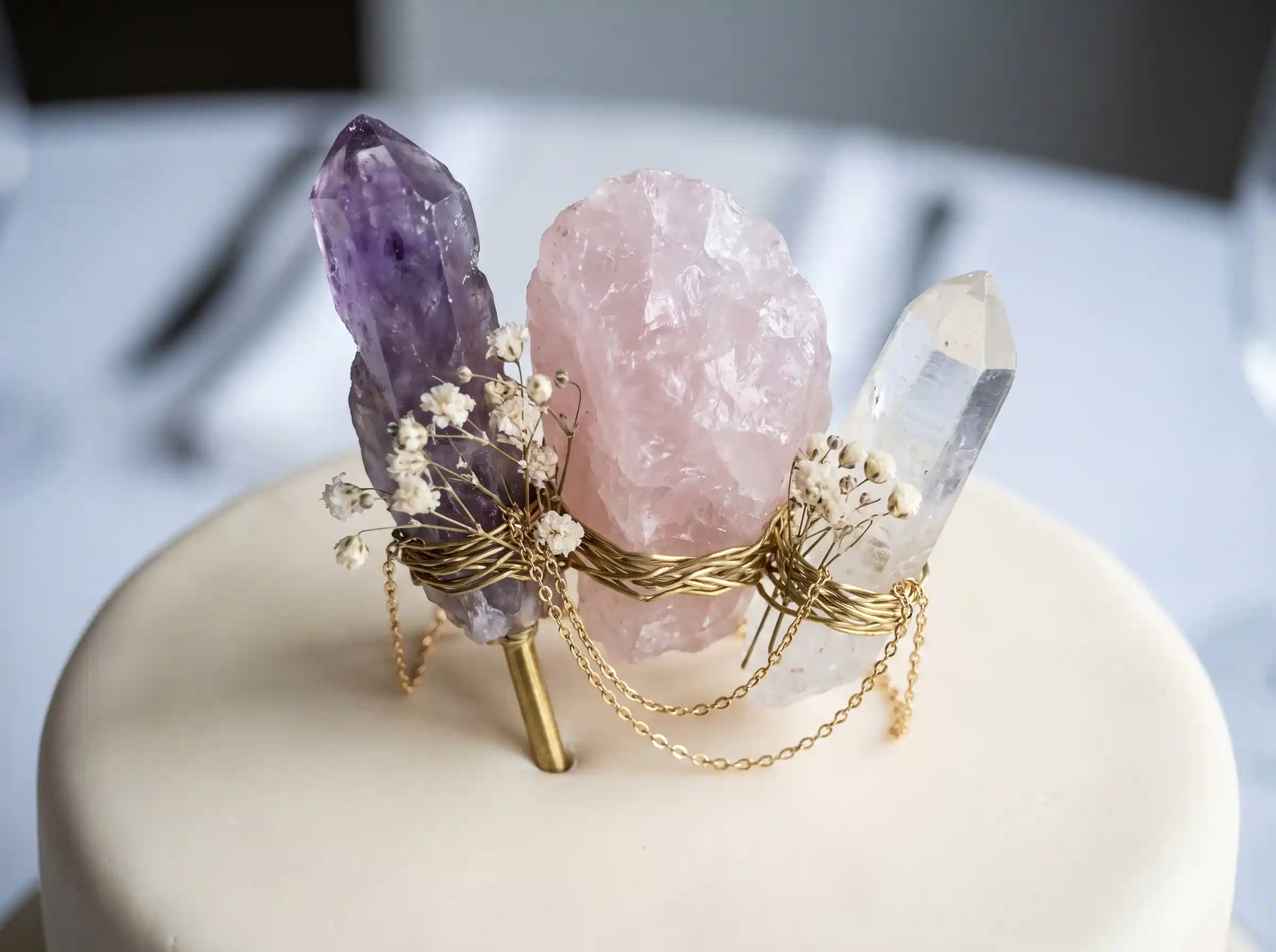 Raw amethyst rose quartz and clear quartz crystal cluster cake topper with gold wire and baby's breath