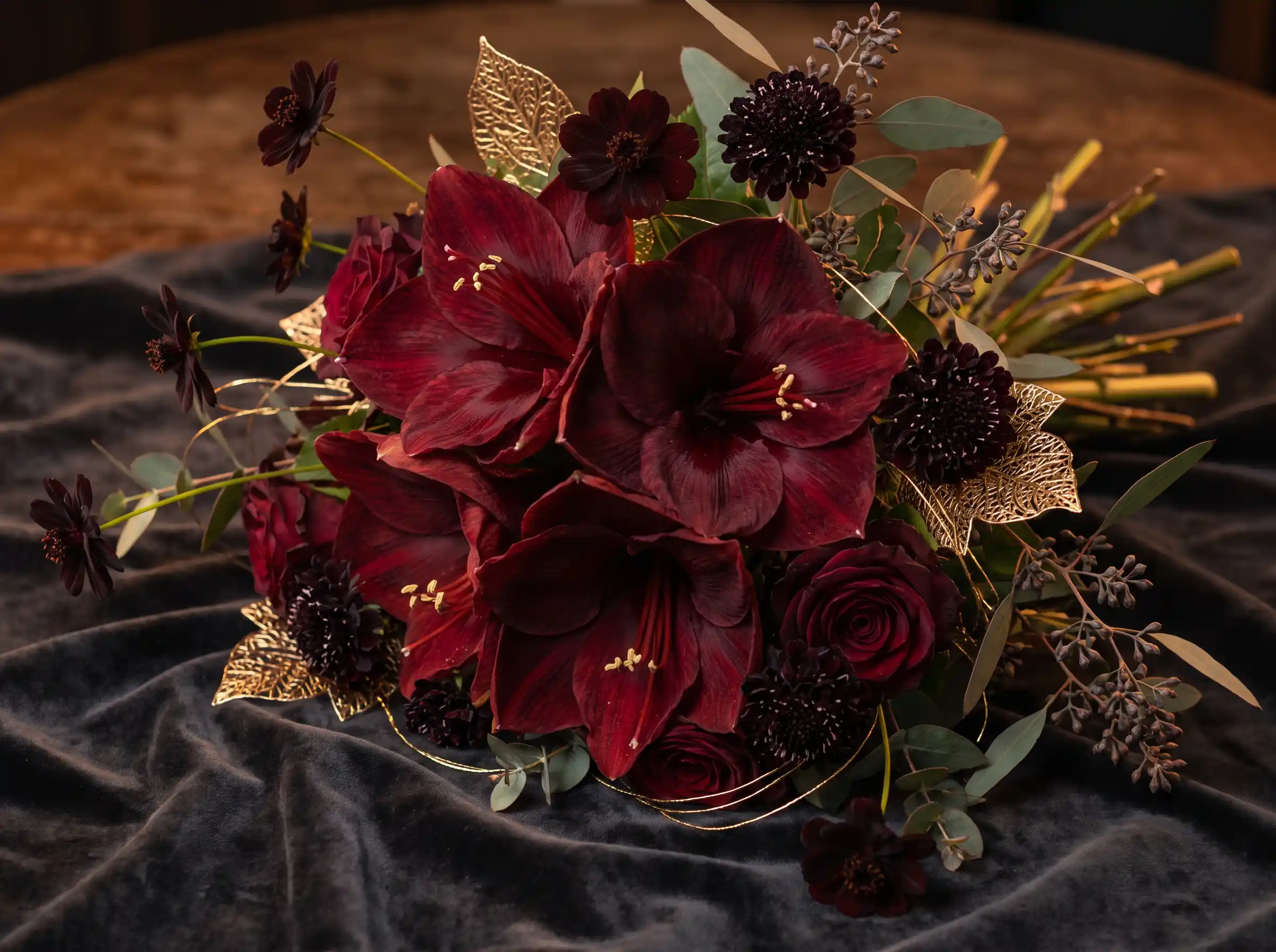 Luxurious burgundy amaryllis bouquet with chocolate cosmos and subtle gold accents