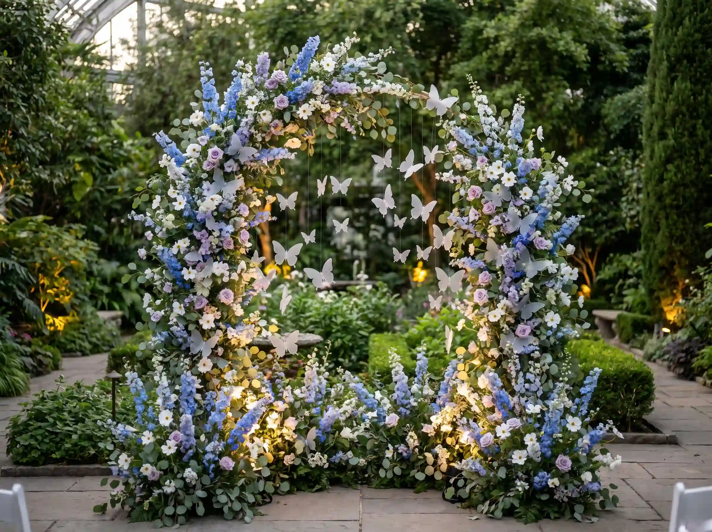 Enchanted blue butterfly delphinium garden wedding with frosted acrylic butterflies and magical uplighting