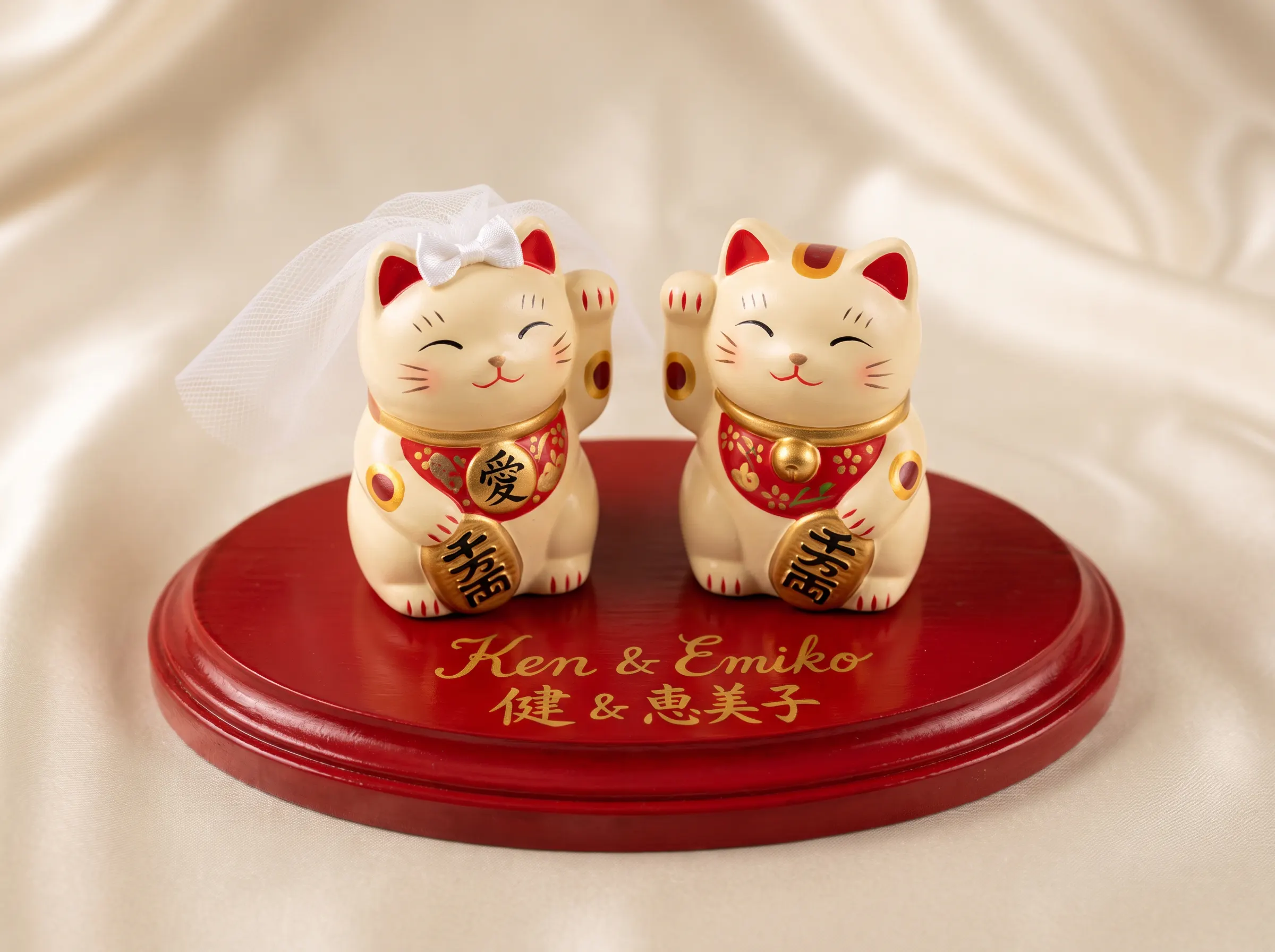 Japanese lucky cat maneki-neko wedding cake topper duo with bridal veil and gold accents
