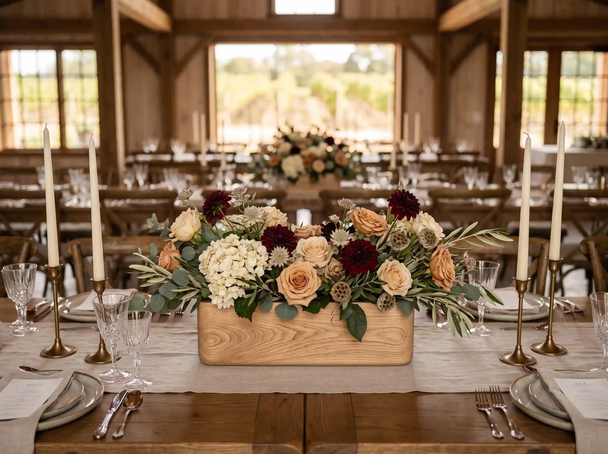 ivory flowers and oak leaf accents in harvest themed wedding table arrangement