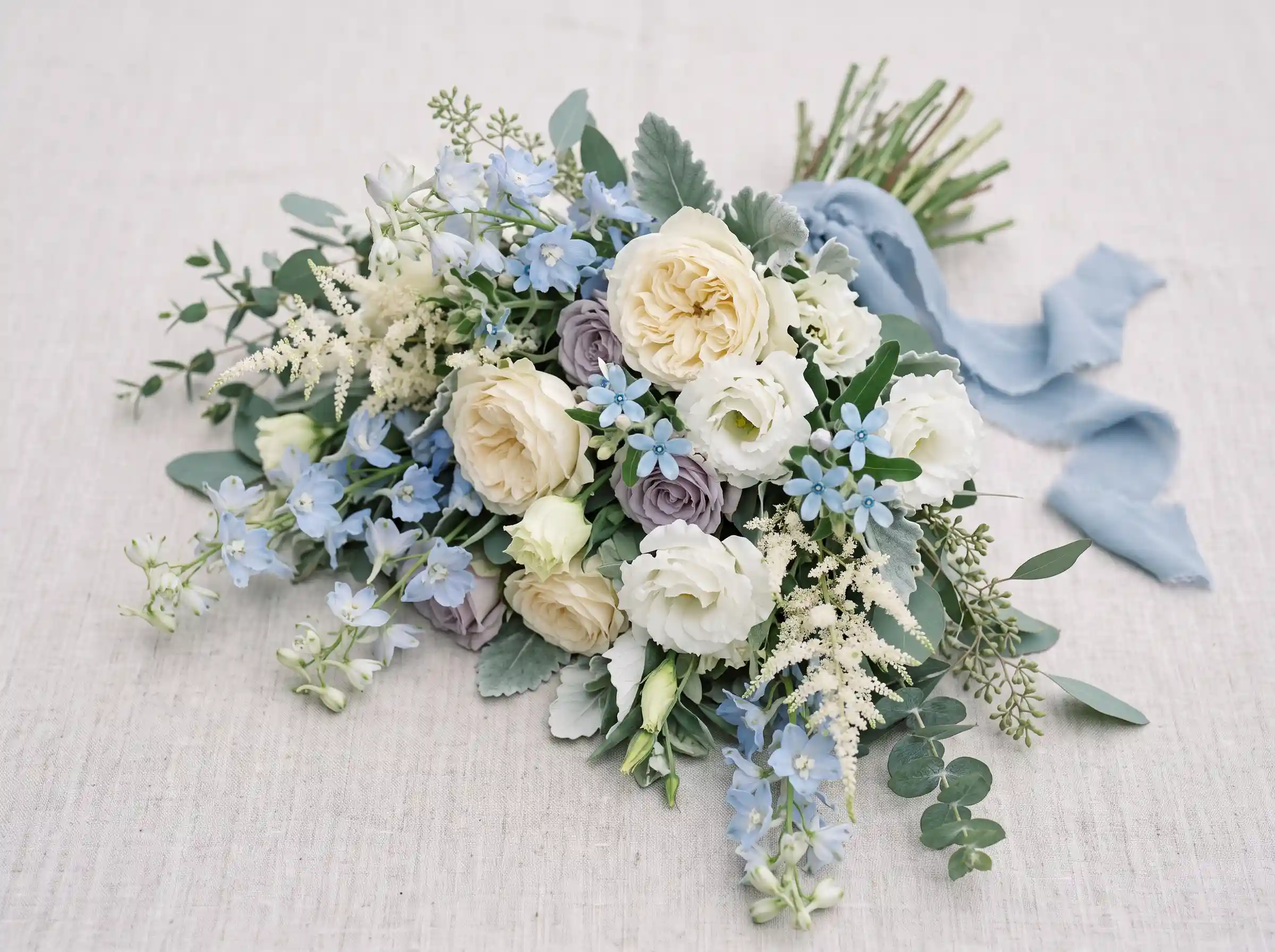Cool dusty blue and lavender rose bouquet with meadow-inspired boho wedding design